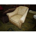 A circa 1900 Armchair of elegant form upholstered in pale gold coloured satin like shadow pattern
