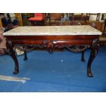 A most unusual dark hardwood Hall Table having four canted cabriole legs with paw feet,