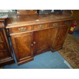An unusual circa 1900 Mahogany Sideboard having three doors, the centre one being recessed,
