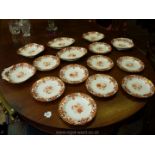 A Royal Crown Derby dessert service, white ground with orange decoration,