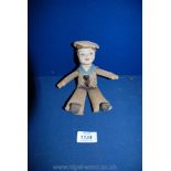 A small Norah Wellings fabric sailor Doll, 8" tall, faded but detail to face good.