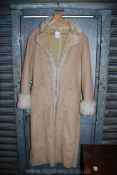 A lady's long sheepskin Coat, light beige, size 44.