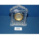 A Waterford Crystal quartz clock 4 3/4" high x 3 1/2" wide.