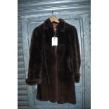 A beaverskin fur three quarter length coat by Baronfur Model.