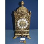 An elegant Brass cased Lantern type mantel Clock having scrolling flowering stem decoration,