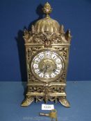 An elegant Brass cased Lantern type mantel Clock having scrolling flowering stem decoration,
