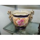 A Victorian Jardiniere in blue and gold with rose pattern and dragon handles,