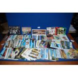 A quantity of Postcards including Ireland, Madeira, Hong Kong, Salcombe, Exmoor, Brownsea Island,