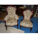 A pair of Mahogany show framed Lady's and Gentleman's buttoned back Fireside Chairs,