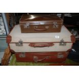 Three suitcases including canvas with leather corners, Warrior Vulcan, etc.