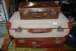 Three suitcases including canvas with leather corners, Warrior Vulcan, etc.