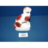 A Staffordshire Spaniel on rectangular base, circa 1820, good condition.