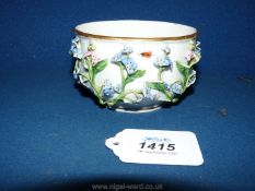 A Meissen sugar bowl circa 1750 or possibly later, with raised floral decoration in early style,