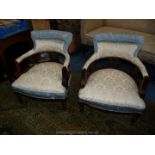 A pair of very appealing Edwardian bow back/tub Armchairs having turned front legs,