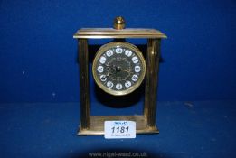 A Looping 15 jewel eight day Brass alarm Clock with four pillars, 5'' tall.