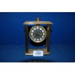 A Looping 15 jewel eight day Brass alarm Clock with four pillars, 5'' tall.