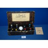 A boxed set of Banda miniature carpet bowls by Brookes & Adams of Birmingham, a/f.