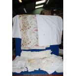 A quantity of white cotton bed linen, embroidered table cloths, etc.