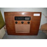 A post WWII Murphy A104 radio with four valves, designed by A.F Thwaite, 18'' x 24'' x 6''.