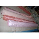 A good quantity of nice quality fabric rolls including sugar pink dupion, dusky pink rayon moire,