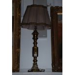 A large brass Lamp, 30" tall, with shade.