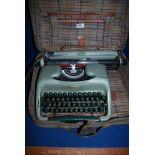 A portable Voss ST32 Typewriter, green,