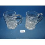 A pair of Stuart Crystal one pint tankards in the Hamilton pattern.