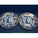 A pair of blue and white oriental wall Plates, having orange blossoms and trees to rim and a figure,