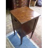 A Mahogany Bedside Cabinet standing on tapering square legs terminating in spade feet,