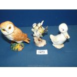 A Beswick owl and duck and a Goebel blue tit on branch.