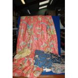 A box of mixed curtains,fabrics in orange with birds and blue chintz.