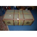 A large canvas, wooden bound Trunk with brass corners, name of ''BAIRD'' to the side.