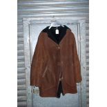 A gent's sheepskin Coat, dark brown, size large.