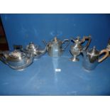 Three Bakelite handled teapots and water jug,