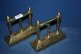 A pair of Brass Fire Dogs,