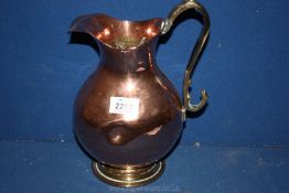 A Copper Jug/ewer with brass handle and base, 11'' tall.