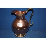 A Copper Jug/ewer with brass handle and base, 11'' tall.