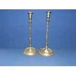 A pair of brass candlesticks