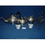 A silver plated embossed Teaset with toast rack and two egg coddlers.