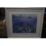 A large framed Print depicting a wild flower meadow with rolling hills, unsigned.