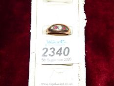 A boxed ''9 ct gold'' marked Gypsy style Ring set with three white and two red stones,