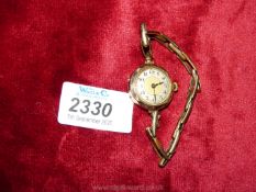A vintage ladies 9ct gold wristwatch with filled gold strap.