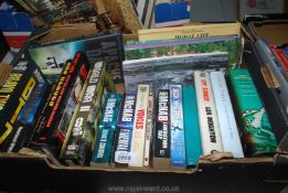 A box of novels including Andy McNab, Jack Higgins and gardening books.