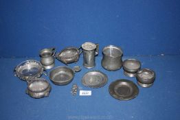 A small quantity of small Pewter to include a porringer with fleur-de-lys to centre and shell