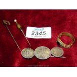 A brooch set with three French coins,