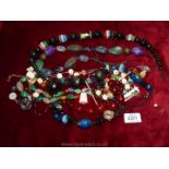 A quantity of costume jewellery including bead necklaces, scarf ring etc.