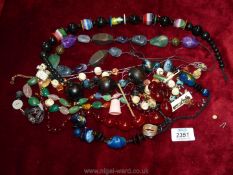 A quantity of costume jewellery including bead necklaces, scarf ring etc.