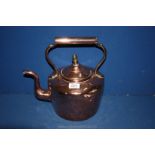 A large Copper Kettle with acorn finial,
