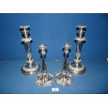 A pair of Art Deco candlesticks with swirls and leaves,
