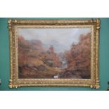 A large ornate carved gilt framed Watercolour depicting a wooded river landscape with powerful
